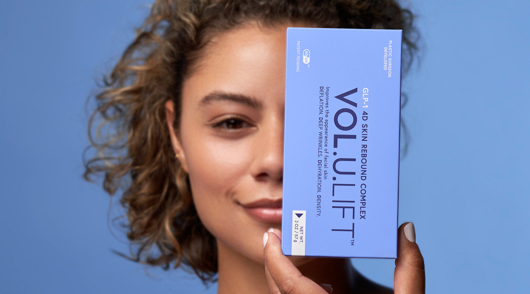 woman holding Vol.u.lift, facial firming treatment