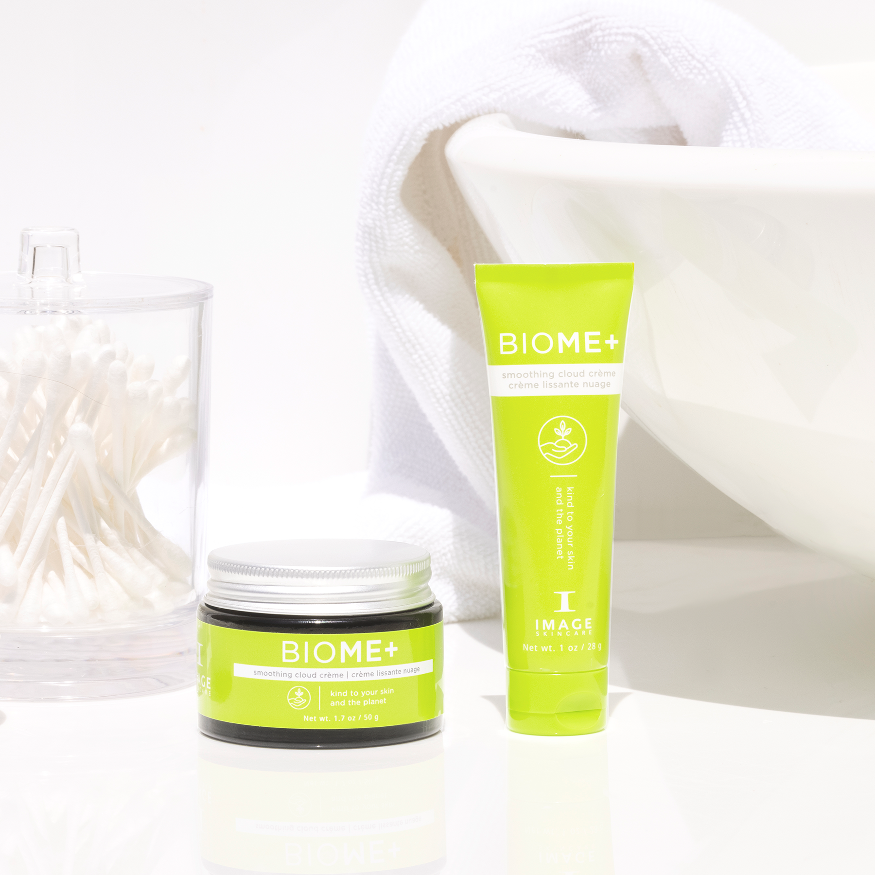 BIOME+ smoothing cloud creme retail and travel size on white bathroom counter