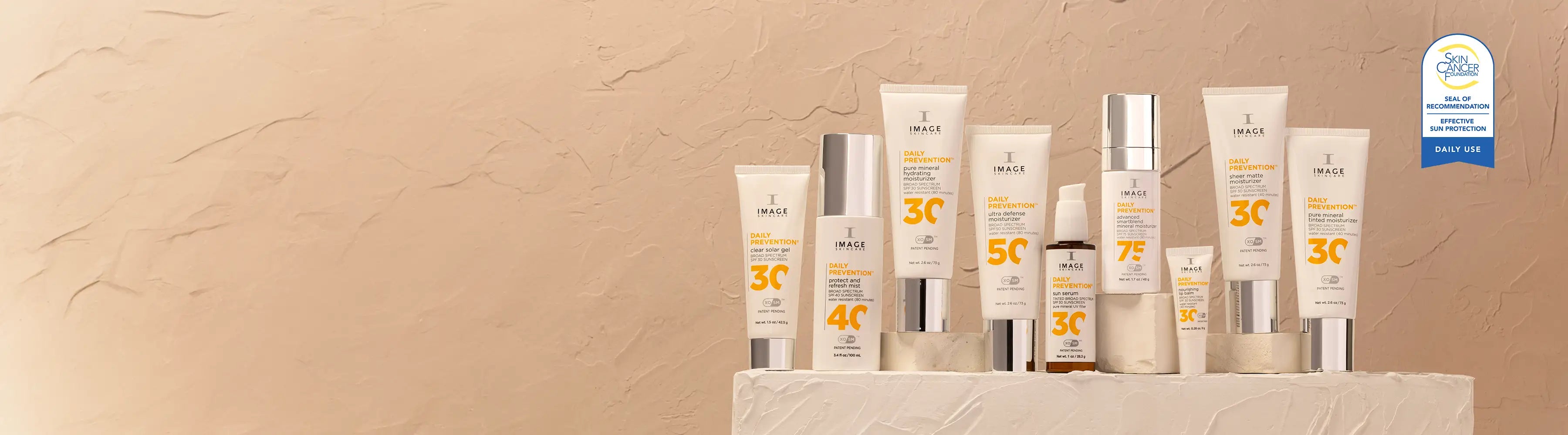 Collection of sunscreen products with SPF 30 on a beige background