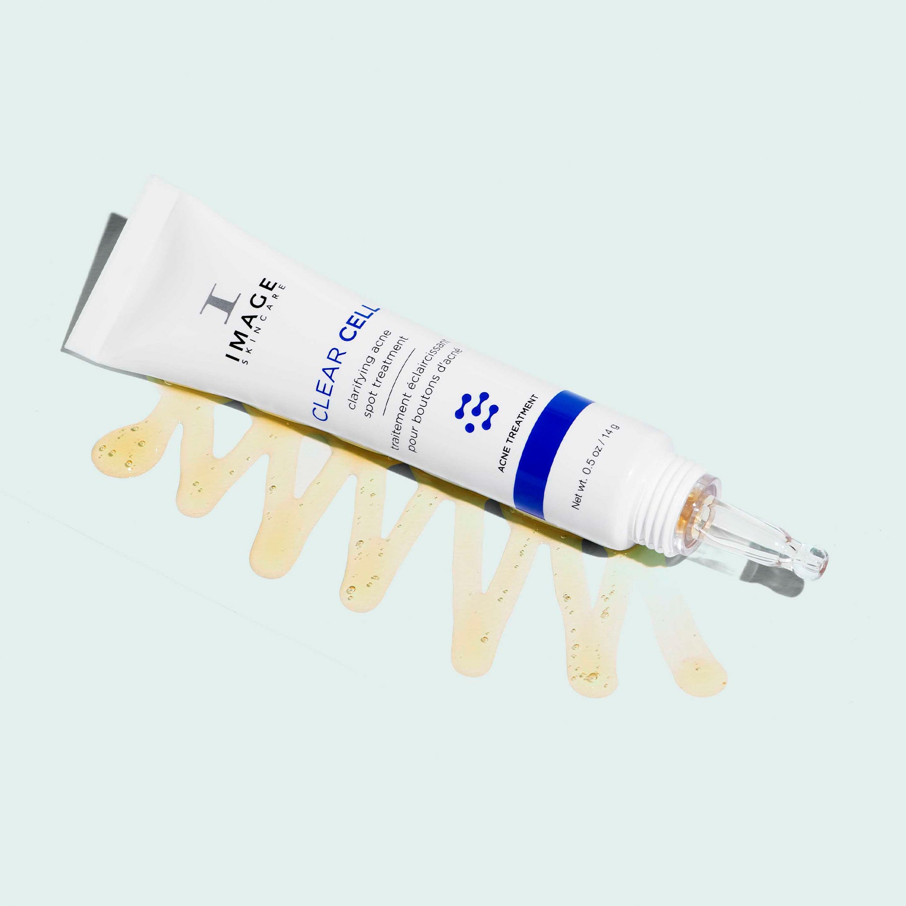 Clarifying acne spot treatment tube laying on its side
