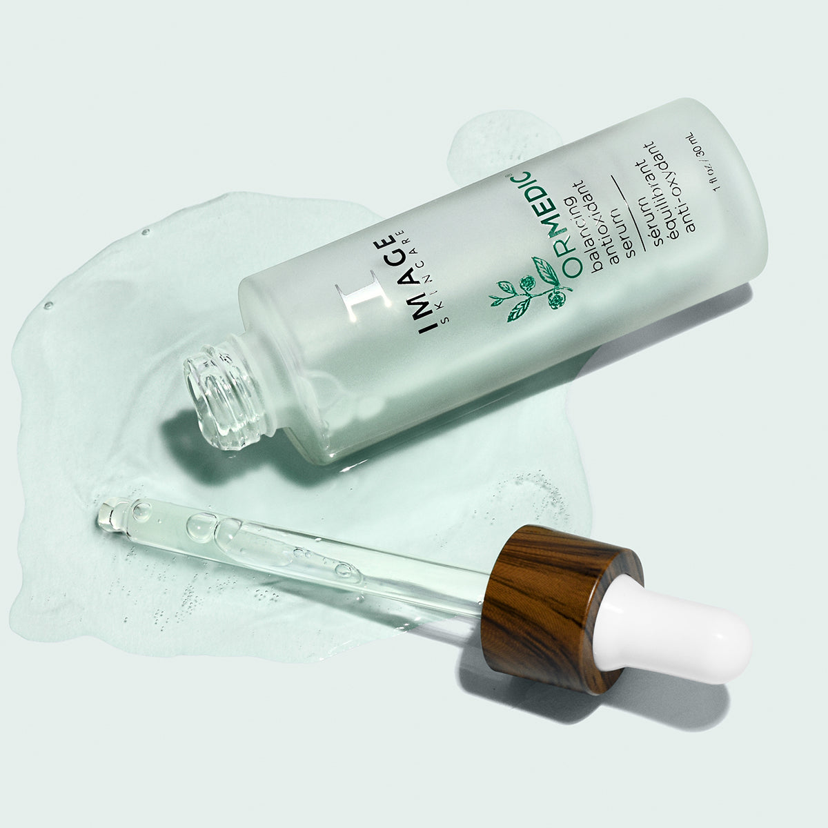 An open bottle of ORMEDIC antioxidant serum.