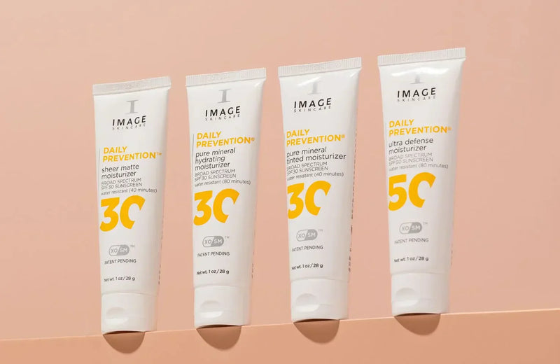 Daily Prevention SPF 30 & 50 on a peach background 