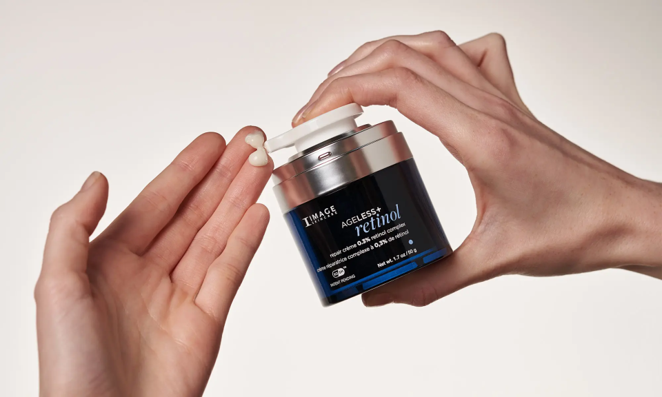 AGELESS+ retinol repair creme 0.3% being dispensed onto hand