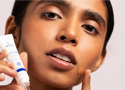 acne girl holding Clear Cell
