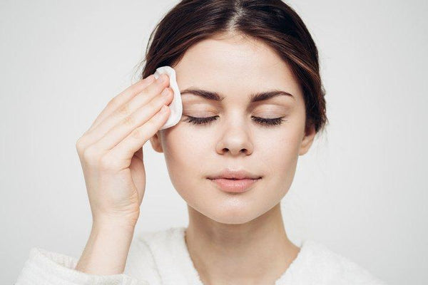 woman using Clear Cell clarifying tonic