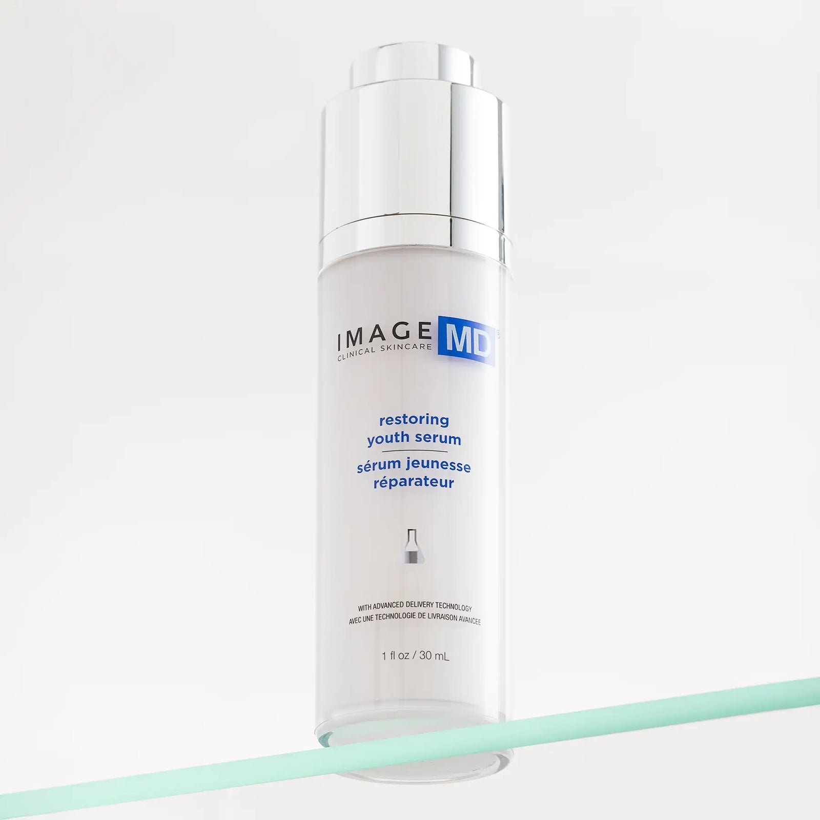Skincare serum bottle labeled 'Image Skincare restoring youth serum' on a white background