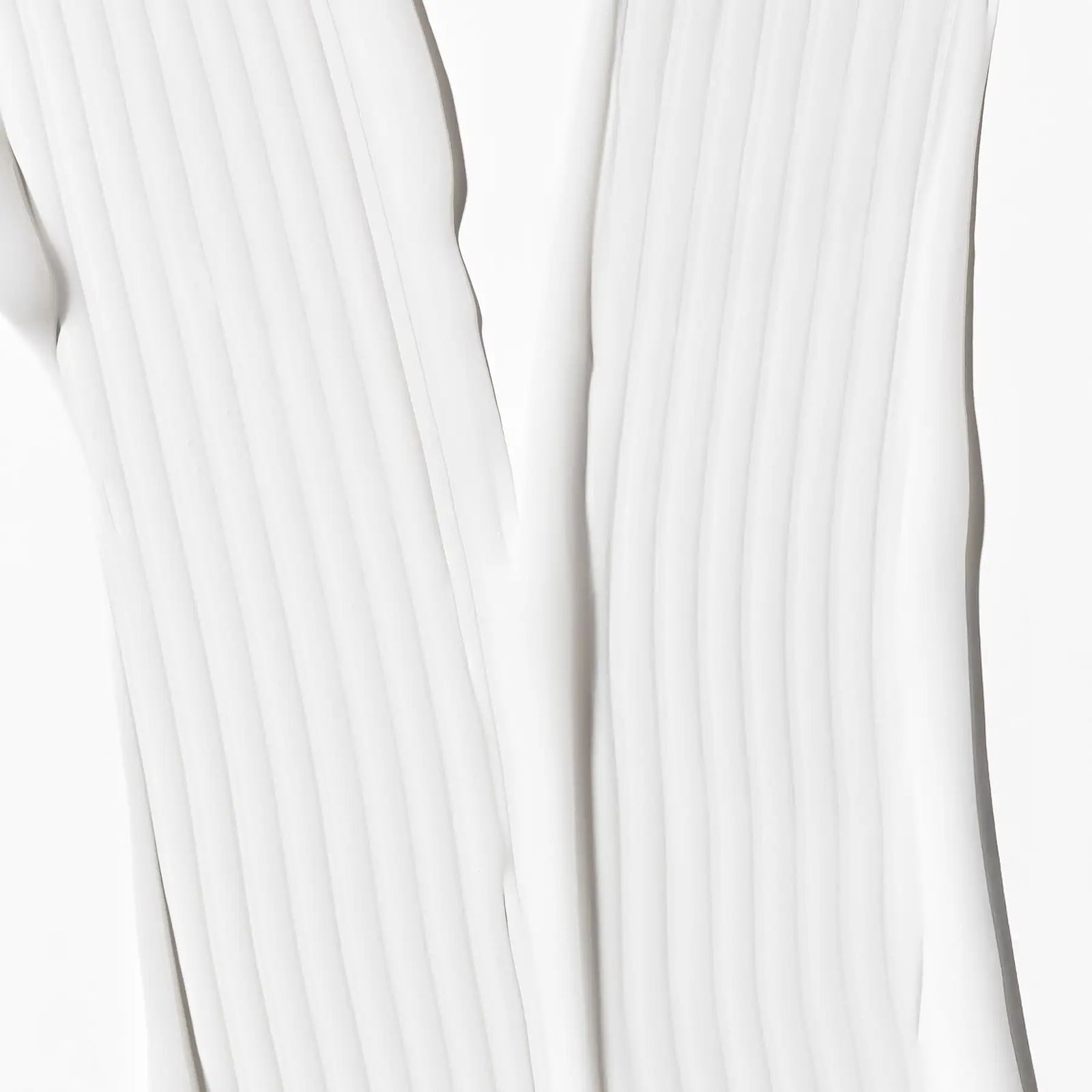 Close-up of white fabric with a subtle pattern