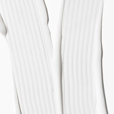 Close-up of white fabric with a subtle pattern