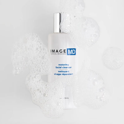 IMAGE MD restoring facial cleanser bottle on a textured white background