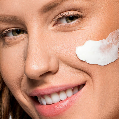 model with product applied on cheek