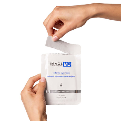 model hands tearing open eye mask packaging