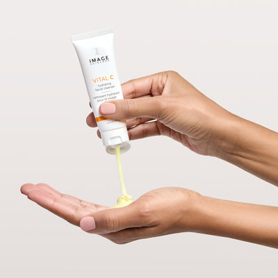 model hands squeezing cleanser onto palm