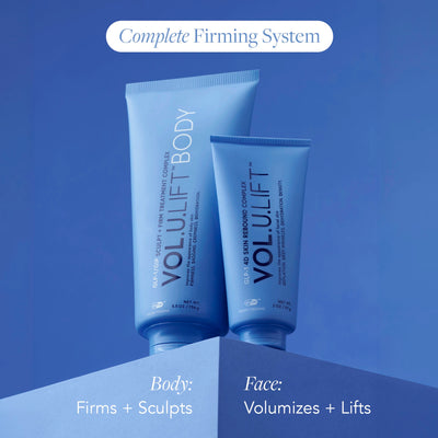 Two blue cosmetic tubes labeled VOLULIFT BODY and VOLULIFT FACE on a blue gradient background, with text reading 'Complete Firming System' and 'Body: Firms + Sculpts' and 'Face: Volumizes + Lifts'.