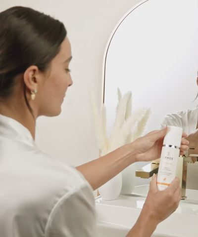 woman applying vital c cleanser