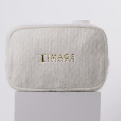 video of white bag and products spinning on block