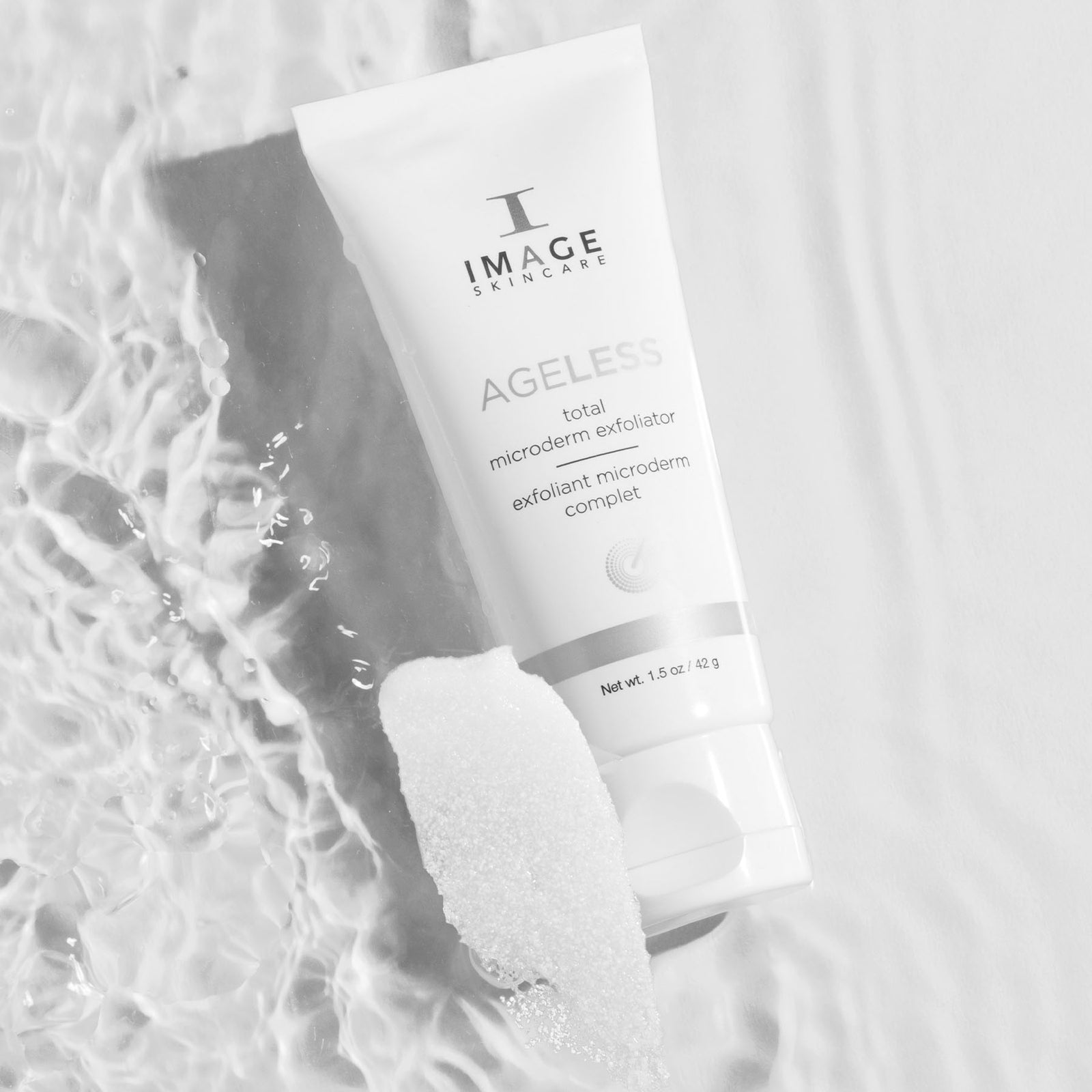 Ageless microderm product bottle floating on water
