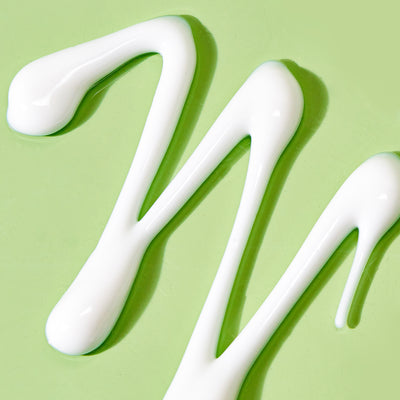 texture shot of cleansing comfort balm on green background