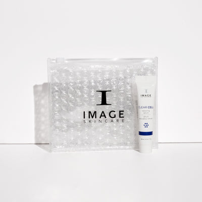 Clear cell restoring serum travel size next to clear bubble bag