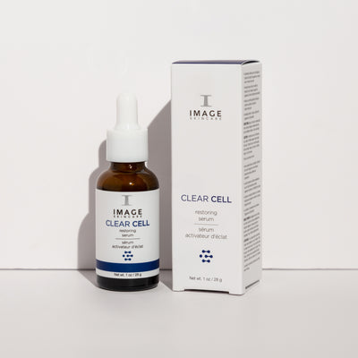 clear cell restoring serum bottle and packaging box on white background