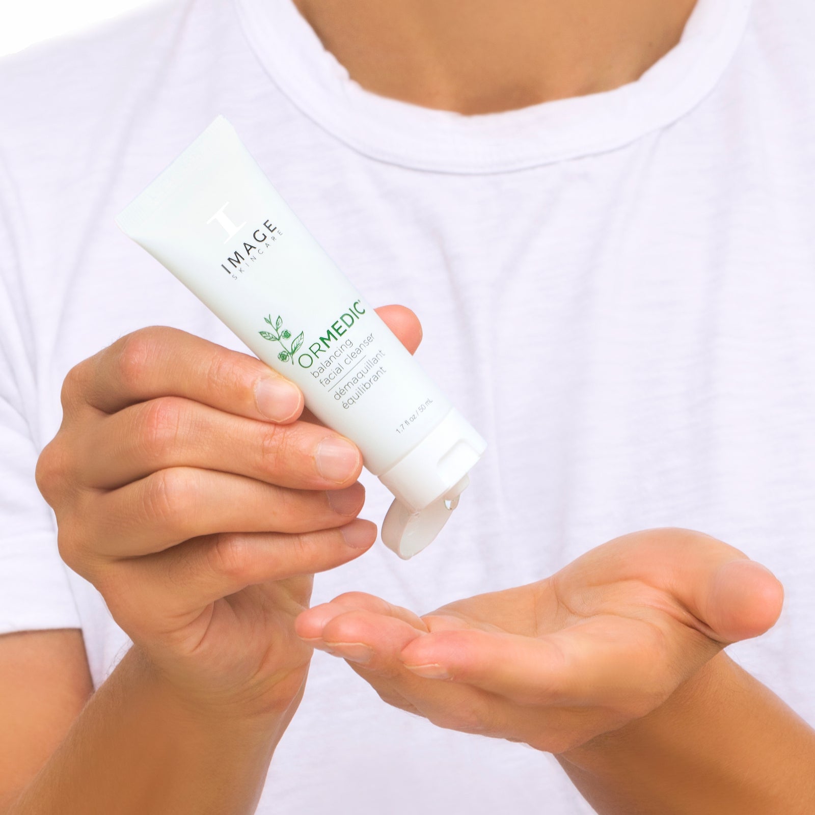 model hands dispensing cleanser onto palm