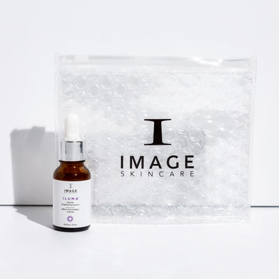 image brightening serum travel size bottle next to clear bubble bag
